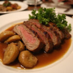 Deliciously cooked beef shoulder roast with vegetables and gravy.