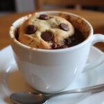Delicious chocolate chip mug cookie ready to be enjoyed.