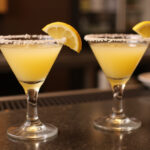 Finished lemon drop shots garnished with lemon wedges, ready to serve.
