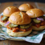 Juicy Hanky Panky sliders with pickles and onions, ready to serve.