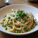 Juicy Pasta and Peas garnished with parsley and parmesan cheese.