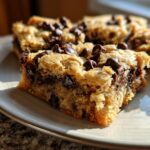 Close-up of chocolate chip cookie bars on a plate. These are not Snoopy dog cupcakes.