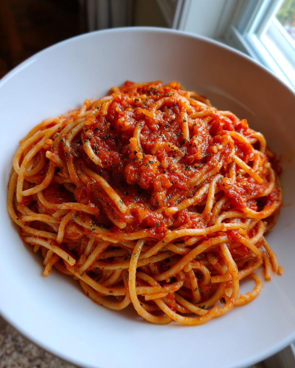 A bowl of spaghetti with marinara sauce, a simple and easy dinner idea.