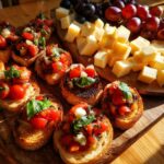 A festive New Years Eve food spread featuring fresh tomato bruschetta and a cheese and grape board.